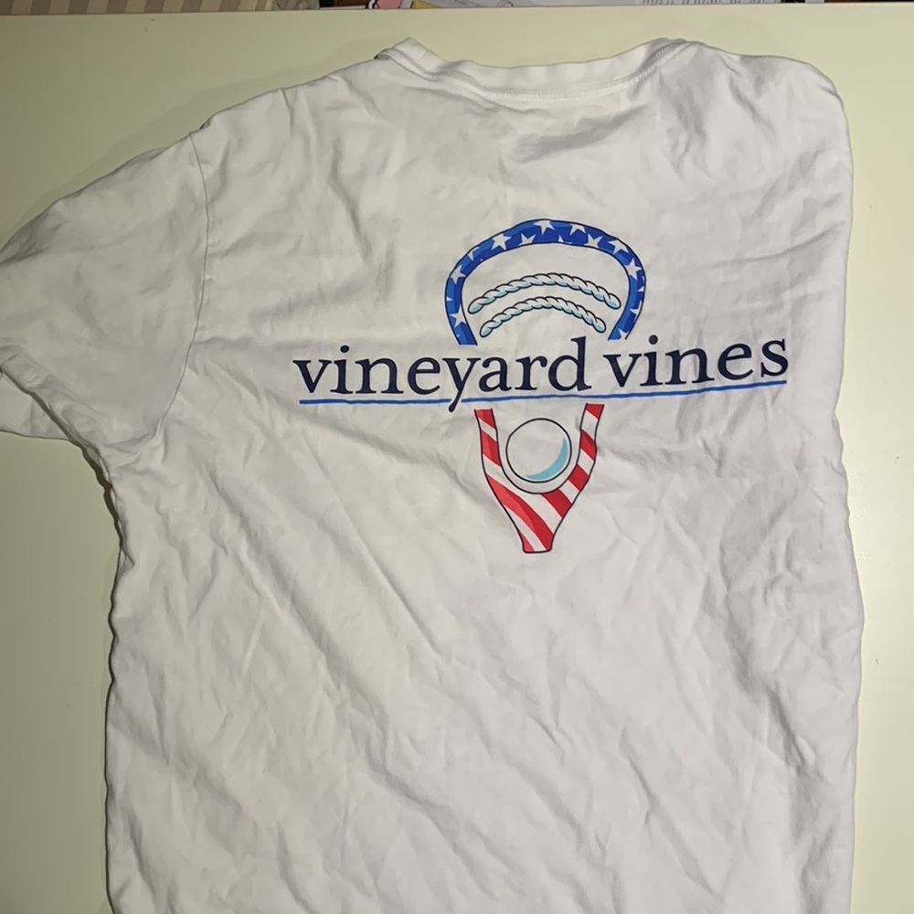 Vineyard Vines, short sleeve tee, men’s M, red white and blue lacrosse stick.